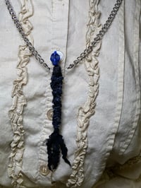 Image 4 of Mini protection voodoo doll necklace. 