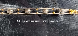 Image of Silver Barrel and Bead Guitar String Bracelet