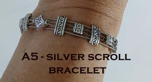 Image of Scroll Guitar String Bracelet