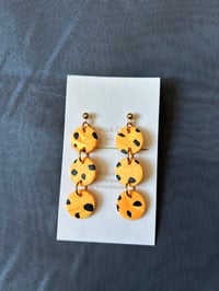 Image 2 of Spotted Orange Circles earrings