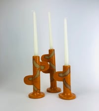 Image 1 of Orange candlestick holder