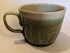 Hand throw, stoneware mug with carved green glaze. Image 2