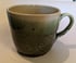 Hand thrown, stoneware mug with spotted green glaze. Image 3