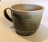 Hand thrown, stoneware mug with carved green glaze Image 2