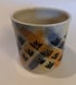 Hand thrown, stoneware mug with purple and orange, decoration. Image 2