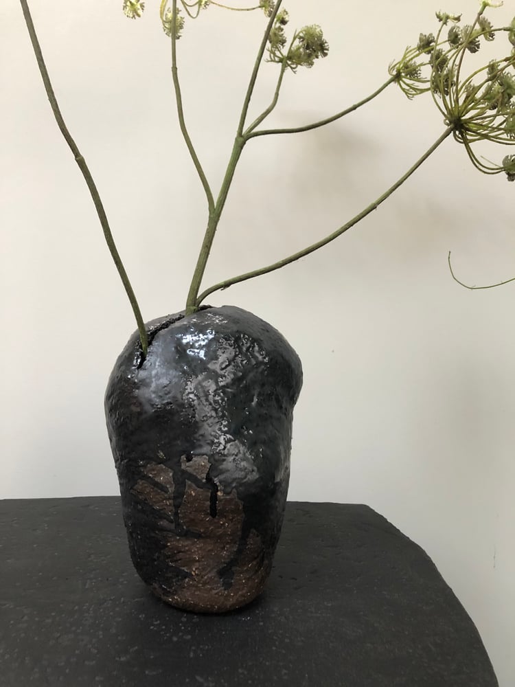 Image of handshaped ceramic vase