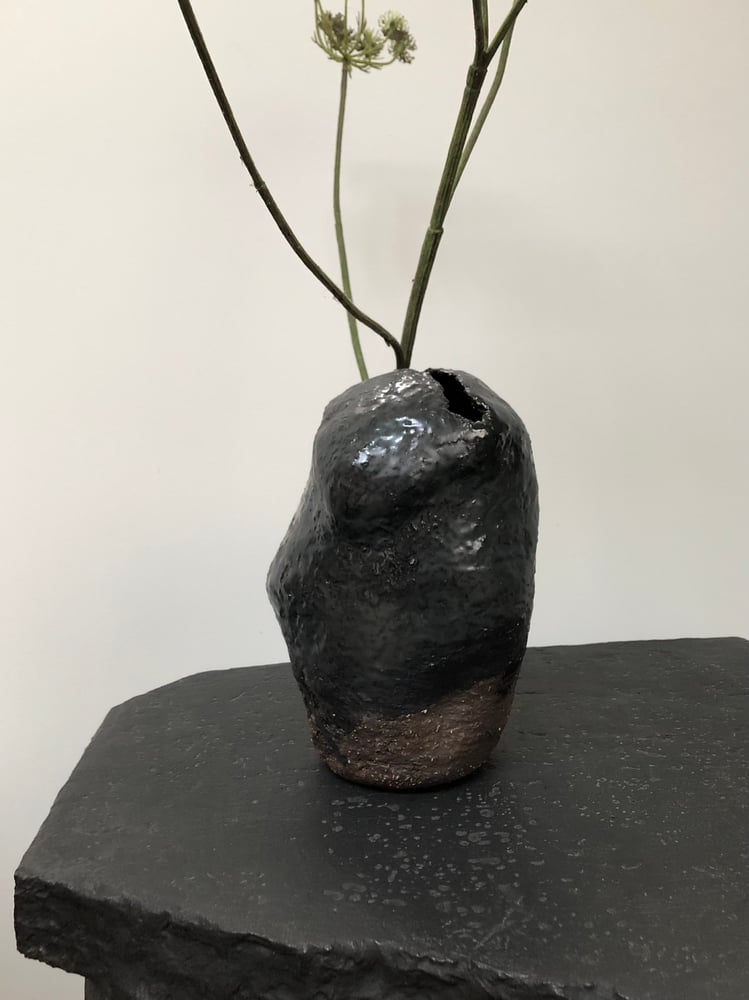 Image of handshaped ceramic vase