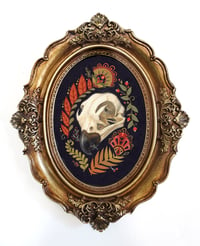 The Relic in oval antiqued frame