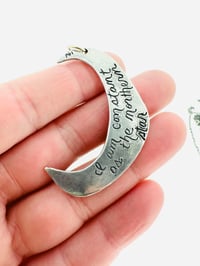 Image 4 of turquoise moon necklace with handwritten Shakespeare quote