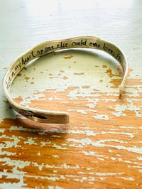 Image 1 of sterling silver engraved feather Fitzgerald love quote cuff