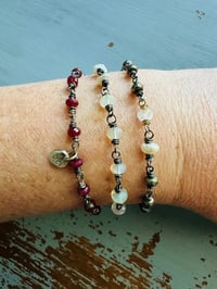 Image 3 of boho ruby and pearl charm bracelet . 14k gold and sterling silver