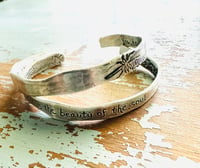 Image 3 of sterling silver engraved feather Fitzgerald love quote cuff