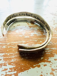 Image 7 of sterling silver engraved feather Fitzgerald love quote cuff