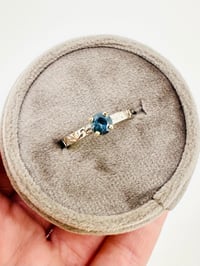 Image 1 of size 7 fair trade teal blue Australian sapphire engagement ring