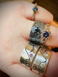 Image 3 of size 7.5 purple spinel engagement ring with engraved vine band