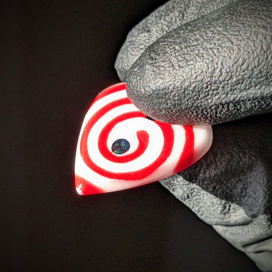Image of Red and White Spiral Glass Guitar Pick Pendant 