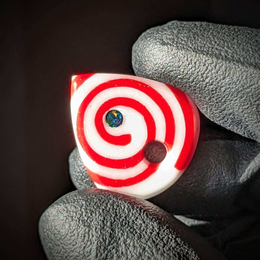 Image of Red and White Spiral Glass Guitar Pick Pendant 
