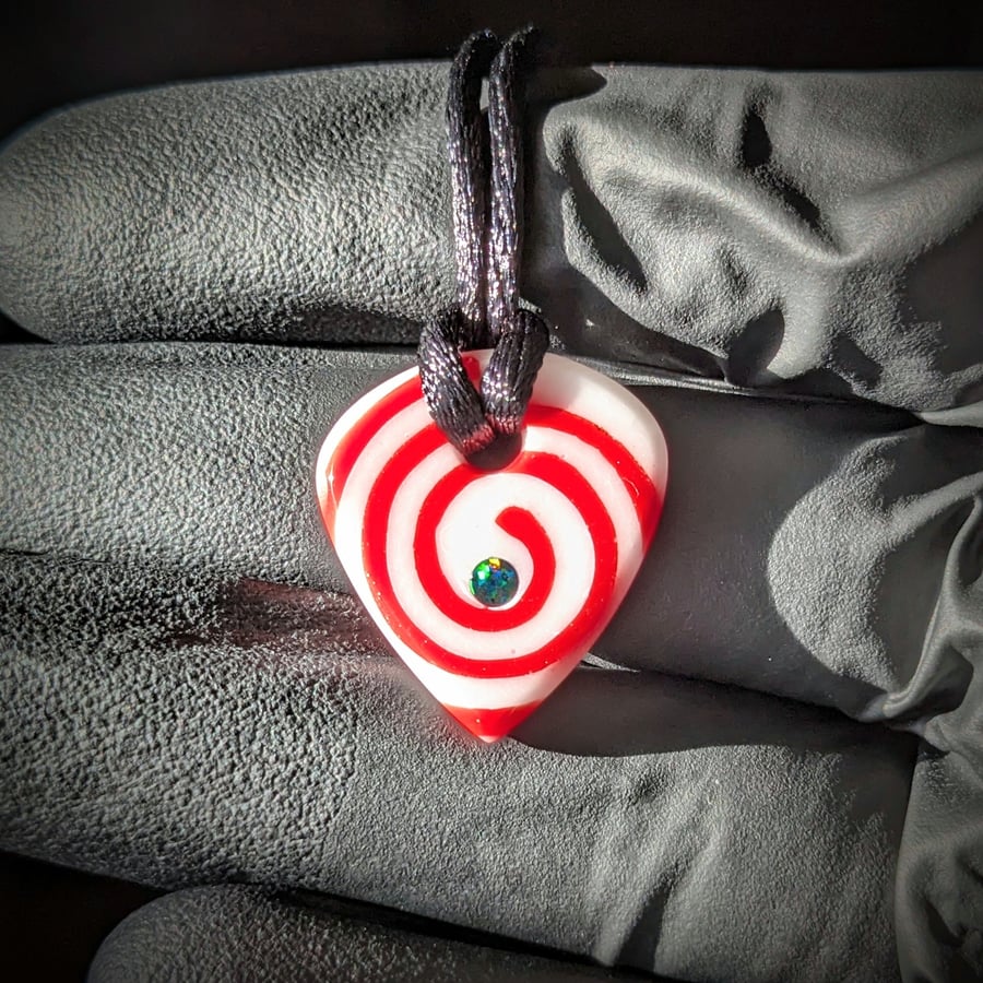 Image of Red and White Spiral Glass Guitar Pick Pendant 
