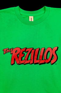 REZILLOS T-Shirt red logo on green shirt.