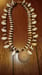 Image of SUNDIAL SHELL W/DOUBLE STRAND MINIATURE SHELLS, COWRIES AND COPPER HEMATITE BEADS 