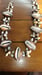 Image of  LARGE COWRIE SHELLS ACCENTED W/MINIATURE SHELLS 