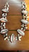 Image of  LARGE COWRIE SHELLS ACCENTED W/MINIATURE SHELLS 