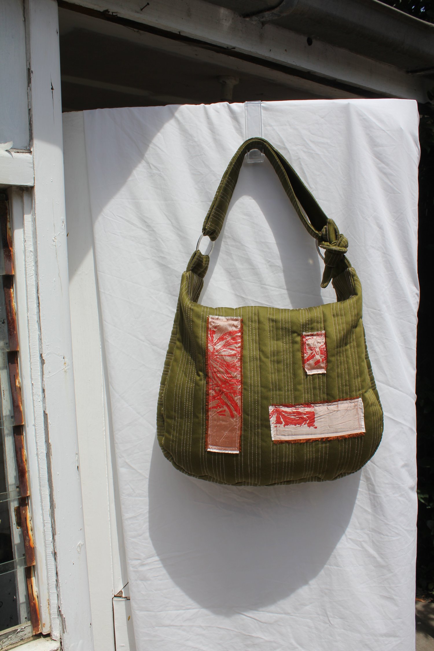 Image of 'vessel to hold your baggage' 006 - large quilted green/pink