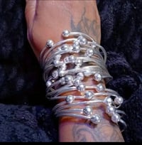 Image 1 of Silver ball expandable bangles