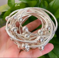 Image 2 of Silver ball expandable bangles