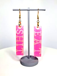 Image 3 of Eat S#!T Dangle Earrings