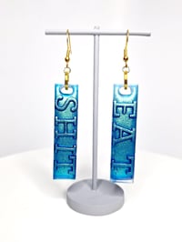 Image 1 of Eat S#!T Dangle Earrings