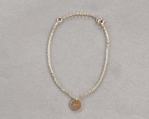 Image of *Sample Sale - was £245* 9ct gold ‘Pace’ engraved disc bracelet with ruby.