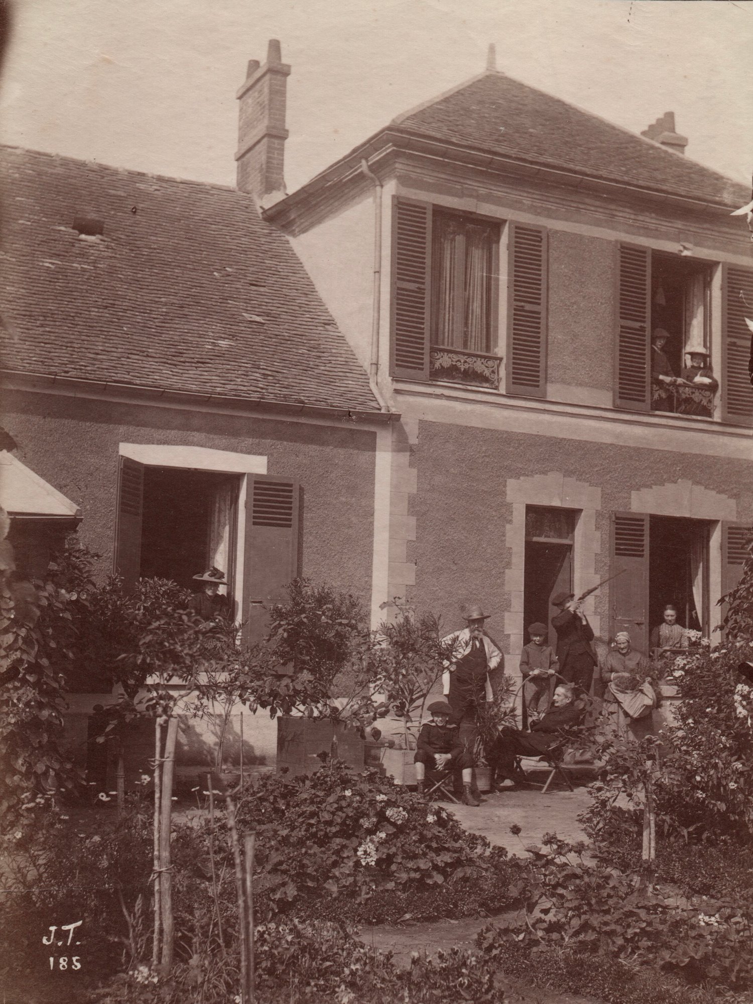 Image of J.T.: family portrait in a garden, France ca. 1880
