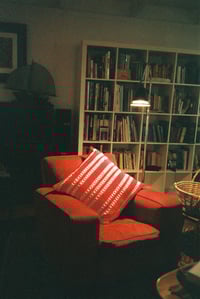 Image 1 of red and white cushion