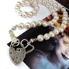 Sterling silver heart padlock clasp on a string of freshwater on pearls 