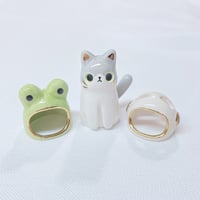 Image 1 of 2 in 1 frog hat and astronaut helmet cat ceramic figurine