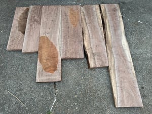 Various figured walnut boards.