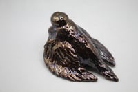 Image 2 of doomer pigeon with a cig sculpture 