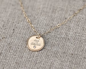 Image of 9ct gold Latin engraved round disc necklace with diamond