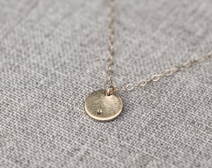 Image of 9ct gold Latin engraved round disc necklace with diamond