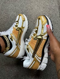 Gold Nikes 