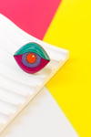 Anillo ojo fucsia