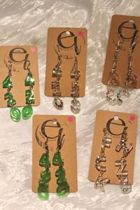Image 1 of letter statement earrings (fck nzs, 161, 1312, 420, acab, equality)