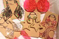Image 1 of star earrings, different variations 