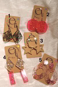 Image 2 of star earrings, different variations 