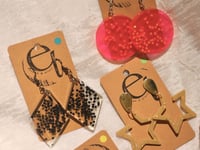 Image 4 of star earrings, different variations 