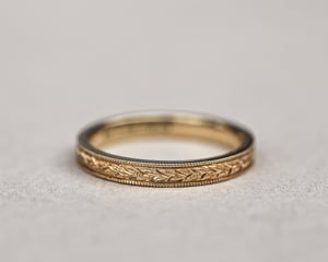 Image of 18ct Yellow gold, 3mm Flat court Laurel Leaf and Milled edge engraved ring