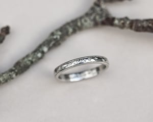 Image of  Platinum 3mm,  Latin engraved milled edge ring