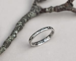 Image of  Platinum 3mm,  Latin engraved milled edge ring