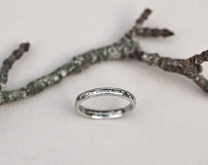 Image of  Platinum 3mm,  Latin engraved milled edge ring